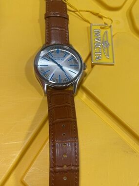 Invicta Silver Dial Watch with Blue Accents and Brown Leather Strap